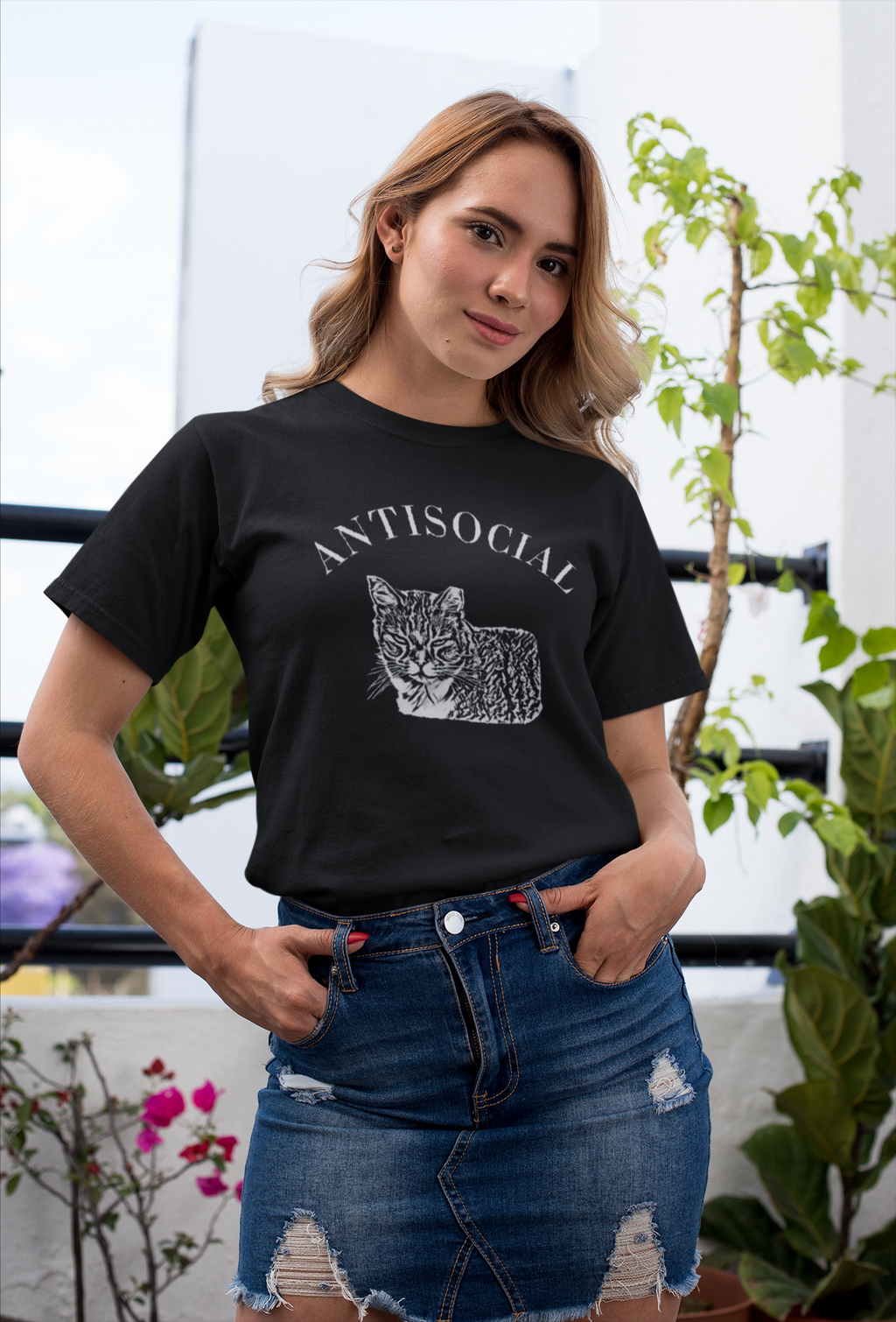 Woman wearing a black T-shirt with a grumpy cat illustration and the word ‘Antisocial.’ Funny cat lover and rescue volunteer shirt. Cat With Ear Tip makes it perfect for TNR Feral Cat Trap Advocates.