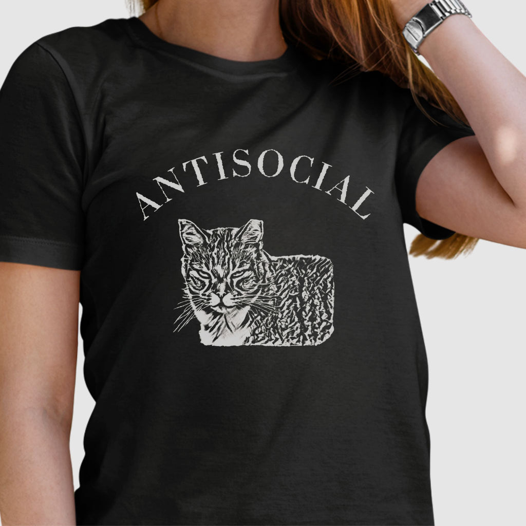 Woman wearing a black T-shirt with a grumpy cat illustration and the word ‘Antisocial.’ Funny cat lover and rescue volunteer shirt. Cat With Ear Tip makes it perfect for TNR Feral Cat Trap Advocates.
