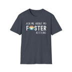 Heather Navy soft t-shirt with text that reads ‘Ask Me About My Foster Kittens’ and a retro styled rainbow paw-print graphic in the word Foster