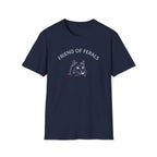 A man wearing a black “Friend of Ferals” TNR awareness shirt featuring a detailed cat illustration and red heart, standing outdoors in the woods. This feral cat rescue shirt supports animal rescue, TNR, and community cat advocates — perfect gift for cat lovers and volunteers. Stray Cat lover.