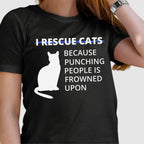Black t-shirt with a white cat graphic and humorous text on a plain background text reads I rescue cats because punching people is frowned upon funny animal resucue shirt with some sass