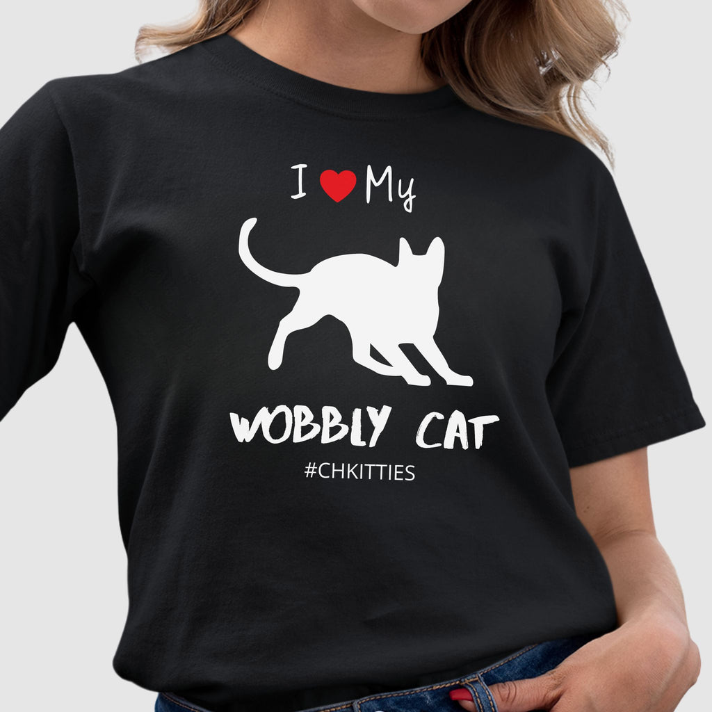 Black t-shirt with a white silhouette of a wobbly cat and text reading ‘I Love My Wobbly Cat #CHKITTIES.’ Special-needs CH cerebellar hypoplasia cat awareness shirt