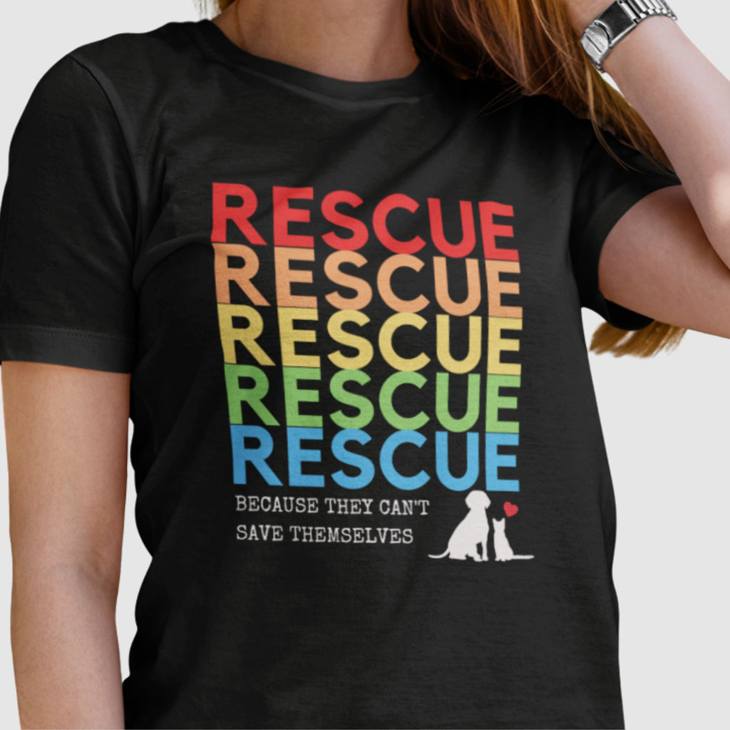 woman wearing a black tshirt with rainbow text that says RESCUE white text beneath says Because they can't save themselves white image of a dog and a cat with a little red heart