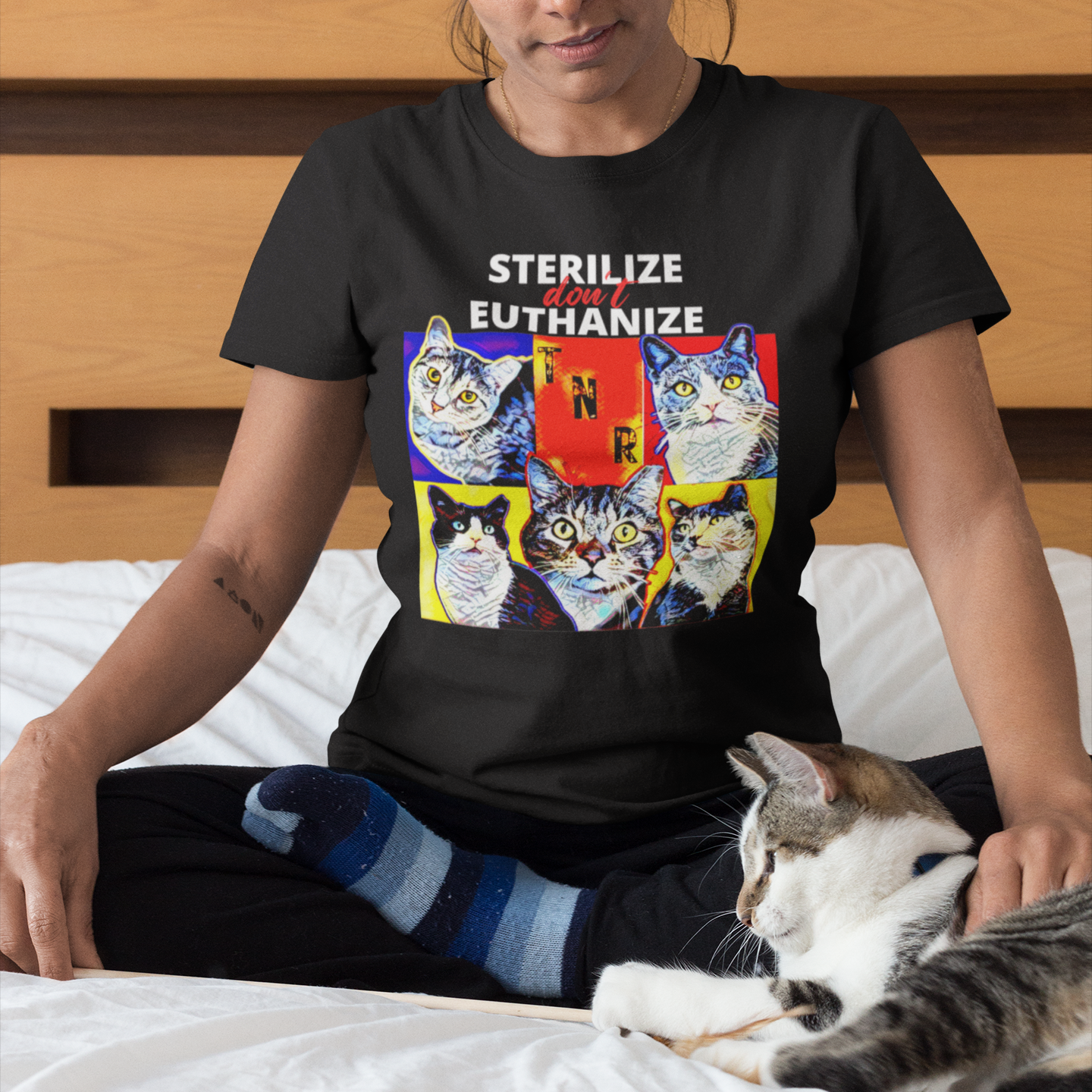 Woman wearing black tshirt with bold artistic design featuring eartipped cats and the words TNR Sterilize Don't Euthanize advocating for feral and stray cat populations. Perfect for Feral Cat Trapper Rescue Volunteer and Spay Neuter Clinic worker and veterinary tech.