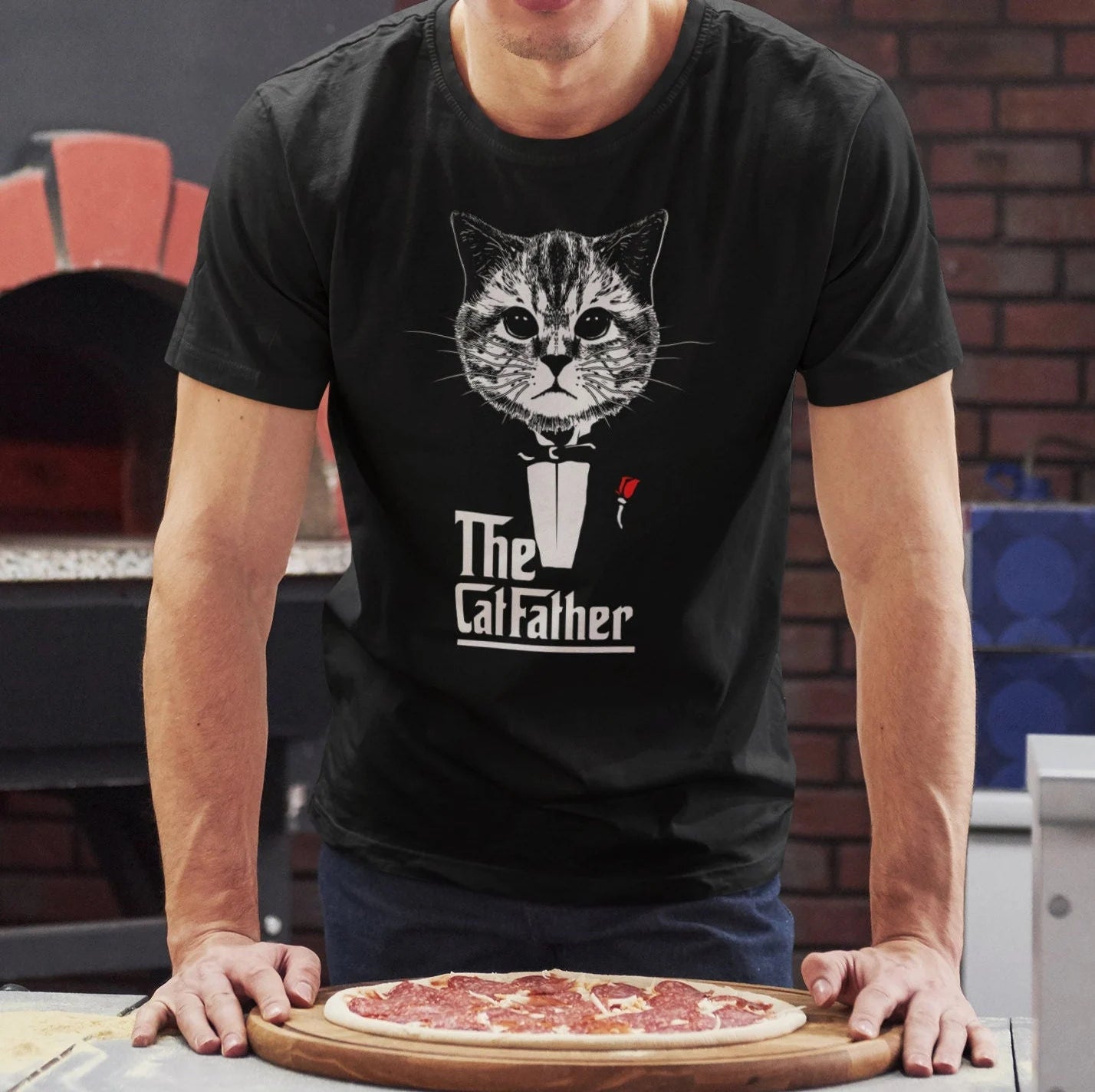 Man wearing a black tshirt with cat dressed in black tuxedo with red rose in the style of the classic movie bold stylized print reads The Cat Father 